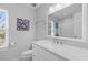 Bathroom featuring a white vanity, mirror, and a view of the natural light from the window at 471 Springfield Rd, Mount Pleasant, SC 29464