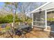 Outdoor deck with a table, chairs, and partial screening, offering backyard view at 471 Springfield Rd, Mount Pleasant, SC 29464