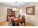 Traditional dining room featuring wood table, leather chairs and a decorative mirror at 471 Springfield Rd, Mount Pleasant, SC 29464