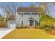 Charming two-story home featuring a well-manicured lawn and an attached two-car garage at 471 Springfield Rd, Mount Pleasant, SC 29464