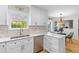 Updated kitchen featuring white cabinetry, modern appliances and eat-in breakfast area at 471 Springfield Rd, Mount Pleasant, SC 29464