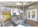 Inviting screened porch with comfortable seating and a ceiling fan, perfect for relaxing outdoors at 471 Springfield Rd, Mount Pleasant, SC 29464
