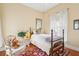 Cozy bedroom features natural light, and vintage furnishings, perfect for relaxation at 48 Montagu St # B, Charleston, SC 29401