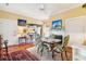 Cozy dining room adjacent to the kitchen, featuring a fireplace and hardwood floors at 48 Montagu St # B, Charleston, SC 29401