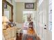Inviting hallway with wood flooring, antique furnishings, and views into the living space at 48 Montagu St # B, Charleston, SC 29401