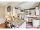 Modern kitchen with granite countertops, stainless steel appliances, and stylish bar seating at 48 Montagu St # B, Charleston, SC 29401