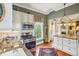 Updated kitchen features stainless steel appliances, granite countertops, and natural light at 48 Montagu St # B, Charleston, SC 29401