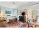 Relaxing main bedroom with large windows, light blue walls, and wood floors at 48 Montagu St # B, Charleston, SC 29401