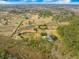Bird's eye view of property showcasing the pond, yard, home and surrounding greenery at 4801 Coon Club Rd, Meggett, SC 29449