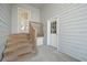 The back entrance features a small deck, stairs, and two entry doors at 4801 Coon Club Rd, Meggett, SC 29449