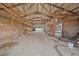 Interior view of a well-lit barn featuring stalls, equipment, and ample storage at 4801 Coon Club Rd, Meggett, SC 29449