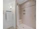 Bathroom featuring tiled shower, built-in niche, neutral colors, and tiled floor at 4801 Coon Club Rd, Meggett, SC 29449