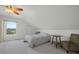 Bedroom with neutral carpet, sloped ceilings, natural light, and standard furnishings at 4801 Coon Club Rd, Meggett, SC 29449