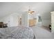 Bedroom features neutral walls and carpet, sloped ceilings, closet and ensuite bathroom at 4801 Coon Club Rd, Meggett, SC 29449