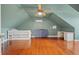 Spacious bedroom featuring hardwood floors, sloped ceilings, and a built-in bed at 4801 Coon Club Rd, Meggett, SC 29449