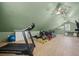 A spacious exercise room area features light floors, unique ceilings, and exercise equipment at 4801 Coon Club Rd, Meggett, SC 29449