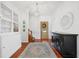 Inviting foyer with hardwood floors, decorative lighting, and a console table, creating a warm entrance at 4801 Coon Club Rd, Meggett, SC 29449