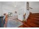 Bright foyer featuring hardwood floors, decorative lighting, and a staircase leading to the second floor at 4801 Coon Club Rd, Meggett, SC 29449