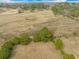 Wide aerial shot of a large plot of land with green foliage and tall trees surrounding the property at 4801 Coon Club Rd, Meggett, SC 29449