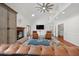 Grand living room showcasing a fireplace, high ceilings, and seamless flow to other living spaces and outdoor views at 4801 Coon Club Rd, Meggett, SC 29449
