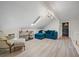 Living room with unique ceiling, wood-look floors, stylish furniture, and a skylight at 4801 Coon Club Rd, Meggett, SC 29449