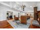 Expansive living room boasting hardwood floors, fireplace, and seamless flow to kitchen and other living spaces at 4801 Coon Club Rd, Meggett, SC 29449