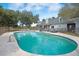 Sparkling private pool with ample seating and meticulously maintained landscaping, perfect for relaxation and entertainment at 4801 Coon Club Rd, Meggett, SC 29449