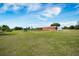Expansive property with a large barn, open fields, and blue skies overhead at 4801 Coon Club Rd, Meggett, SC 29449