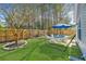 Spacious backyard with a hammock, table set, and manicured lawn at 5024 Wapiti Way, Hollywood, SC 29449