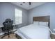 Bedroom with a desk, chair, and wood-trimmed bed frame at 5024 Wapiti Way, Hollywood, SC 29449