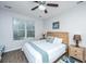 Comfortable bedroom with a ceiling fan, a window with blinds, and a light wood nightstand at 5024 Wapiti Way, Hollywood, SC 29449