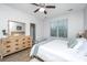 Serene bedroom with a ceiling fan, a window with blinds, and a light wood dresser and headboard at 5024 Wapiti Way, Hollywood, SC 29449