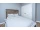 Cozy bedroom with a light grey bedspread and wooden headboard at 5024 Wapiti Way, Hollywood, SC 29449