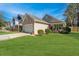 Charming single Gathering home with a two-car garage, cozy front porch, and a beautifully manicured lawn at 5024 Wapiti Way, Hollywood, SC 29449