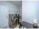 Modern laundry room featuring stainless steel washer and dryer at 5024 Wapiti Way, Hollywood, SC 29449