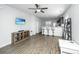 Open concept living room and kitchen area featuring wood floors, recessed lights, and an eat-in bar at 5024 Wapiti Way, Hollywood, SC 29449