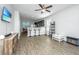 Open concept living room and kitchen area featuring wood floors, recessed lights, and an eat-in bar at 5024 Wapiti Way, Hollywood, SC 29449