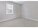 Bright bedroom featuring a window and neutral carpet at 505 Greywood Ln, Goose Creek, SC 29445