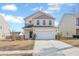 Charming two-story home with yellow siding, a well-manicured lawn, and a two-car garage at 505 Greywood Ln, Goose Creek, SC 29445