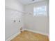 Functional laundry room with tile flooring, shelving, and utility connections, offering convenience and organization at 505 Greywood Ln, Goose Creek, SC 29445