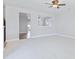Bright living room with neutral carpet and paint, ceiling fan, and open layout at 505 Greywood Ln, Goose Creek, SC 29445