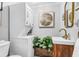 Modern bathroom with a stackable washer-dryer, wooden vanity, and decorative tile at 507 Stinson Dr # 5E, Charleston, SC 29407