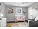 Inviting Bedroom with crib, gray walls, decorative rug and plenty of natural light at 507 Stinson Dr # 5E, Charleston, SC 29407