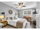 Light and airy bedroom with wooden ceiling fan, TV, and light wood furniture at 507 Stinson Dr # 5E, Charleston, SC 29407