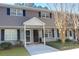 Charming townhome features a brick and siding facade, a covered entryway and a well-manicured lawn at 507 Stinson Dr # 5E, Charleston, SC 29407