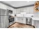 Modern kitchen featuring stainless steel appliances, white cabinetry, and ample counter space at 507 Stinson Dr # 5E, Charleston, SC 29407
