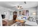 Bright and airy living room boasting a comfortable sofa, ceiling fan, and modern accents at 507 Stinson Dr # 5E, Charleston, SC 29407