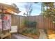 Secluded backyard patio with patio set, umbrella and privacy fence creating a relaxing outdoor space at 507 Stinson Dr # 5E, Charleston, SC 29407
