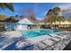 Community pool featuring lounge chairs and clear water, perfect for relaxing and enjoying sunny days at 507 Stinson Dr # 5E, Charleston, SC 29407