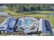 Aerial view of a community pool with palm trees surrounded by townhomes and lush landscaping at 509 Rhythm St, Summerville, SC 29486